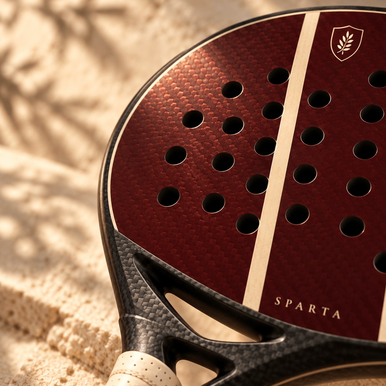KYROS shield on the oxblood carbon face of SPARTA